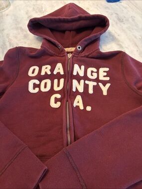 Hollister Maroon Zip-Up Hoodie with 'Orange County C.A.' Applique